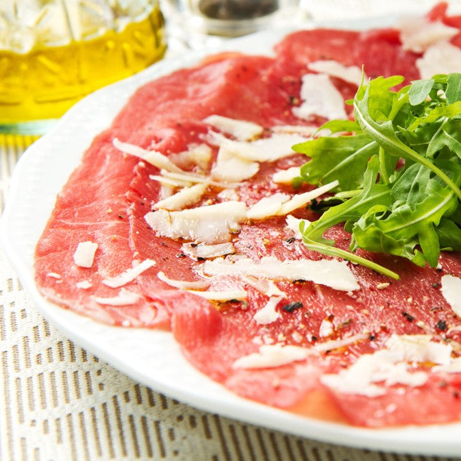 Carpaccio van runds - parmezaan - rucola